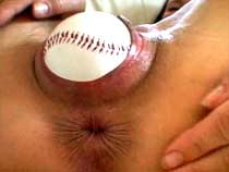 Baseball ball in her ass
